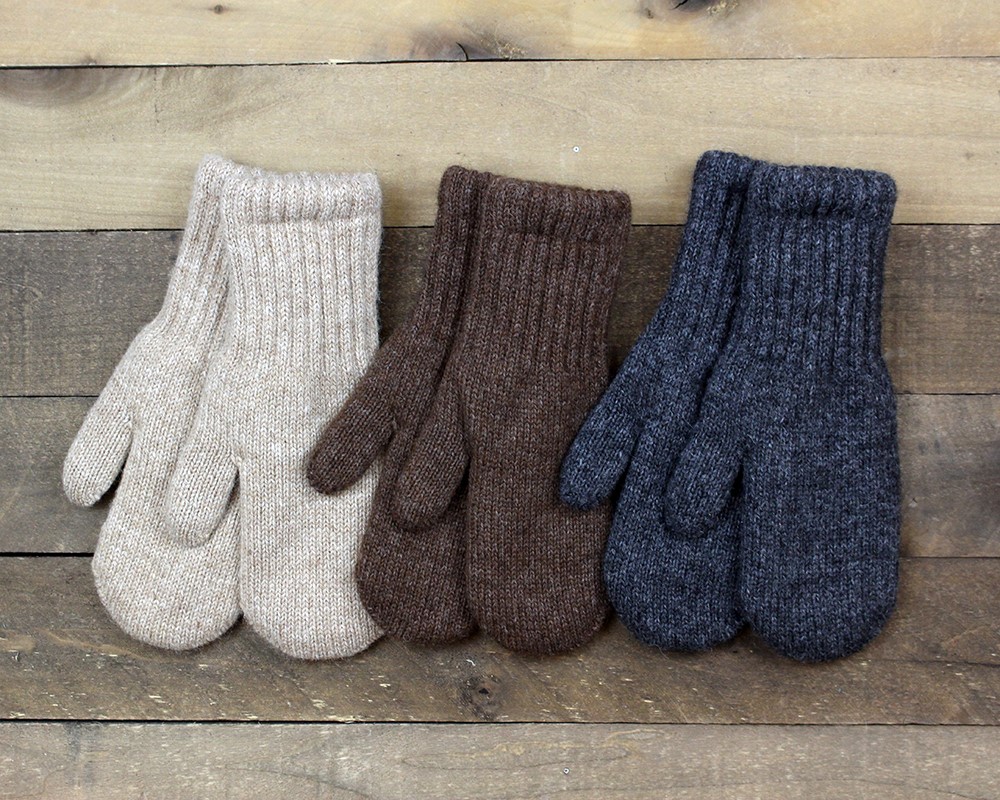 Lined alpaca mittens in a row, neutral tones